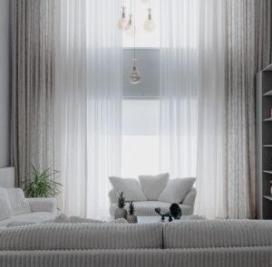 Living luminos amenajat cu canapea deschisă la culoare, covor, plante și mobilier din lemn
